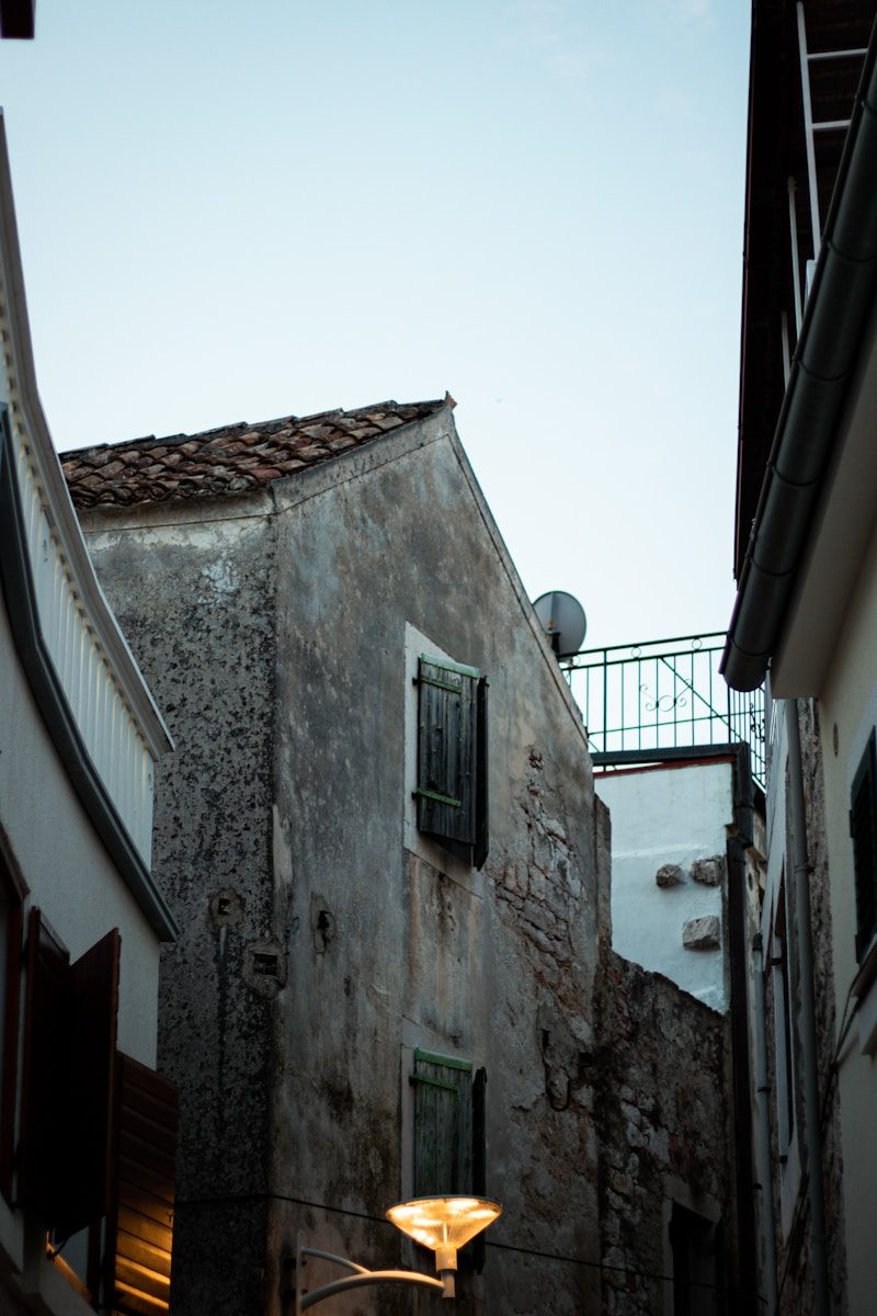 a stone building with a balcony